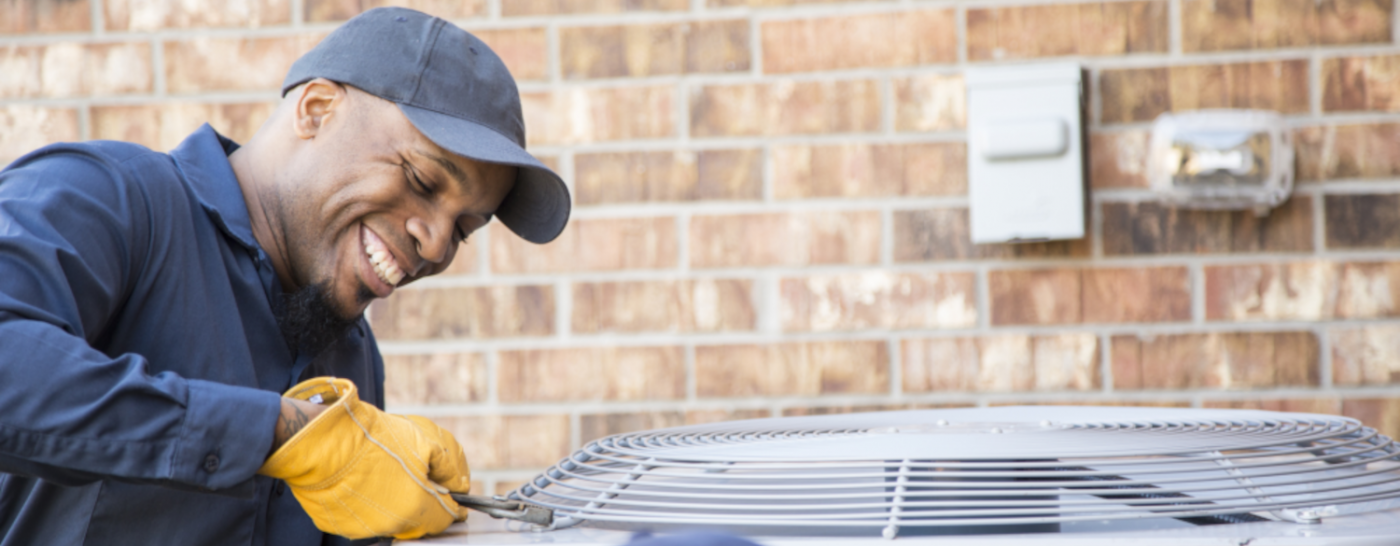 man fixing ac